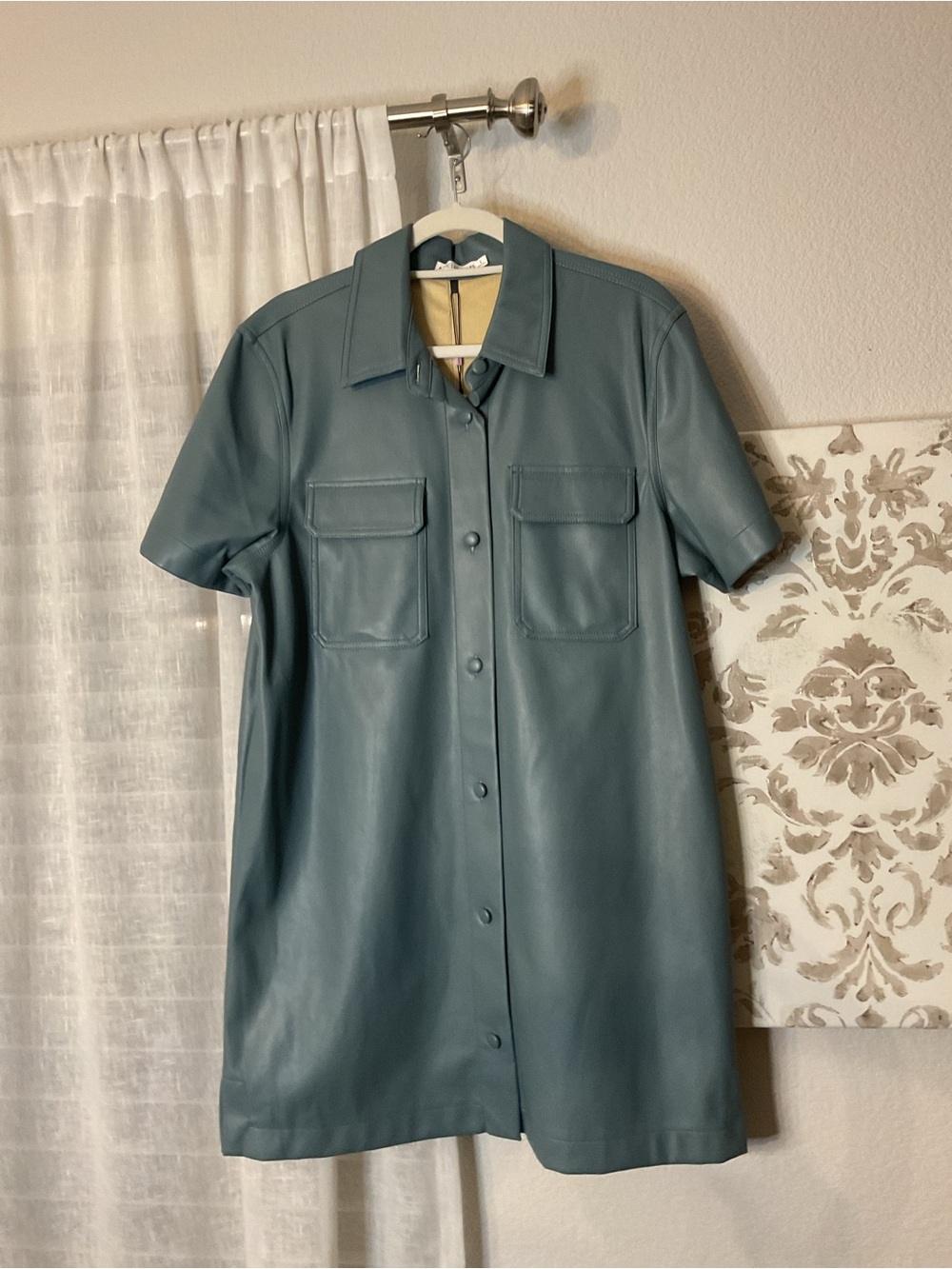 Women's light blue leather jacket with tags